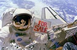 Astronaut Dale A Gardner , Having Just Completed The Major Portion Of His Second Extravehicular Activity ( EVA ) Period In Three Days , Holds Up A " For Sale " Sign Referring To The Two Satellites , Palapa B 2 And Westar 6 That They Retrieved From Orbit After Their Payload Assist Modules ( PAM ) Failed To Fire Astronaut Joseph P Allen IV , Who Also Participated In The Two EVAs , Is Reflected In Gardners Helmet Visor A Portion Of Each Of Two Recovered Satellites Is In The Lower Right Corner , With Westar 6 Nearer Discoverys Aft