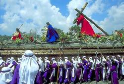 Boys Dressed As Israelites Carrying Enormous Float With Figure Of Christ Carrying His Cross , Antigua , Holy Week ( Semana Santa ) , Guatemala