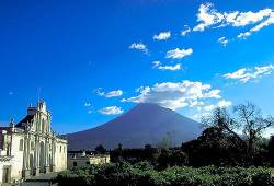 Facade Of The Cathedral Of San Jose Built 1681 On The Central Park With Agua Volcano Behind , Antigua , Guatemala