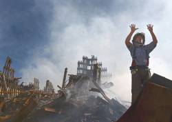 New York , N Y ( Sept 15 , 2001 ) A New York City Fireman Calls For 10 More Rescue Workers To Make Their Way Into The Rubble Of The World Trade Center