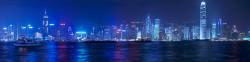 Hong Kong Skyline At Night Viewed From Kowloon Across Victoria Harbour