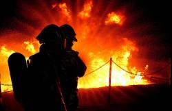 Two Firefighters From The 436th Civil Engineer Squadron Fire And Emergency Protection Flight Practice Putting Out A Combustible Fuel Fire At The Dover State Fire School The Eagle Wings Firefighters Attend The Training Quarterly DOVER AIR FORCE BASE , Del ( AFIE )
