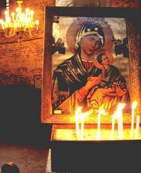 Candles Burn Before An Icon Of The Virgin , Egypt