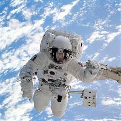 Astronaut Michael L Gernhardt , Mission Specialist , Is Pictured During The September 16 , 1995 , Extravehicular Activity ( EVA ) Which Was Conducted In And Around Space Shuttle Endeavours Cargo Bay Gernhardt , Whose Visor Reflects Endeavours Forward Section , Was Standing On A Mobile Foot Restraint Attached To The Arm Of The Remote Manipulator System ( RMS ) Unlike Earlier Space Walking Astronauts , Gernhardt Was Able To Use An Electronic Cuff Checklist ( ECC ) , Forerunner For Space Station Evaluations For Space Station Era Tools And Various Elements Of The Space Suits Were Performed By Voss And His Space Walking Crewmate , Astronaut James S Voss , Payload Commander ( 16 September 2024 )