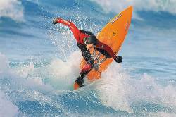 Surfer Executing A Backhand Reentry