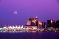 Full Moon Over Vancouver , BC City Skyline At Sunset